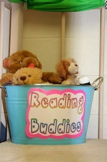 Stuffed animals in reading buddies bucket