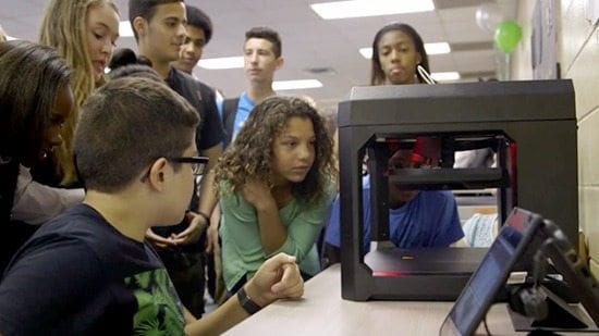Students near 3d printer