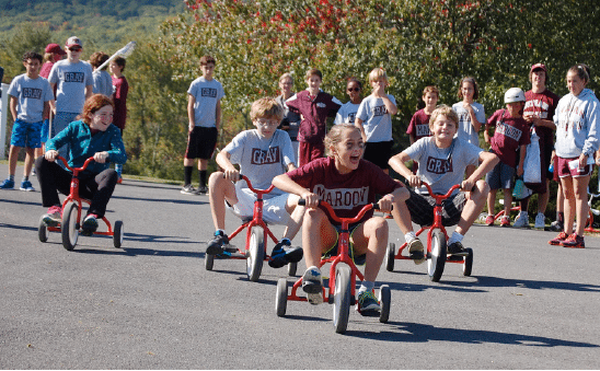 Big kids riding tricycles