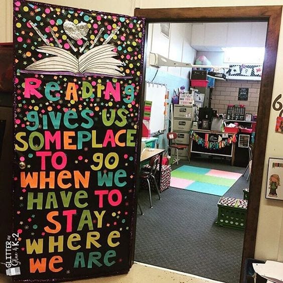 Door decoration of a book and the words "Reading gives us some place to go when we have to stay where we are" -- classroom doors