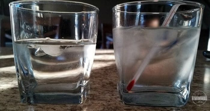 Two glasses of water, one with ice and a thermometer