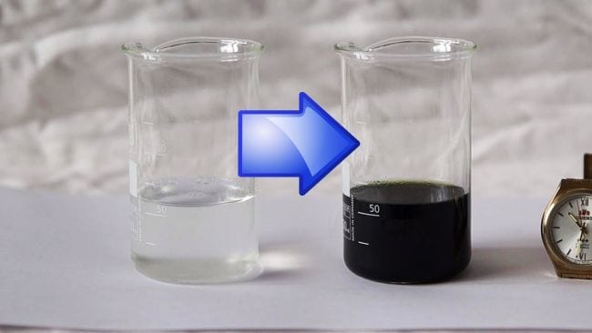 Lab beaker filled with clear liquid next to a beaker of dark liquid, with a blue arrow leading from one to the next (Sixth Grade Science)