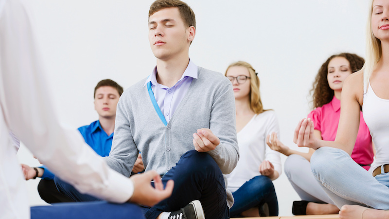 middle school kids doing yoga