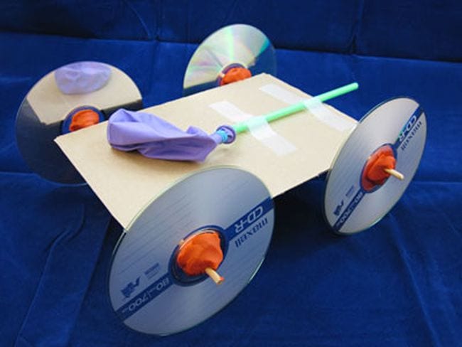 Car built from cardboard with CD wheels and a balloon "motor" (STEM Activities)
