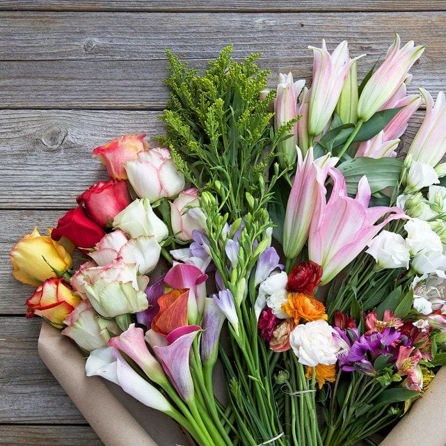 bouquet of Bouqs assorted, colorful farm-fresh flowers on a table, as an example of teacher appreciation gifts