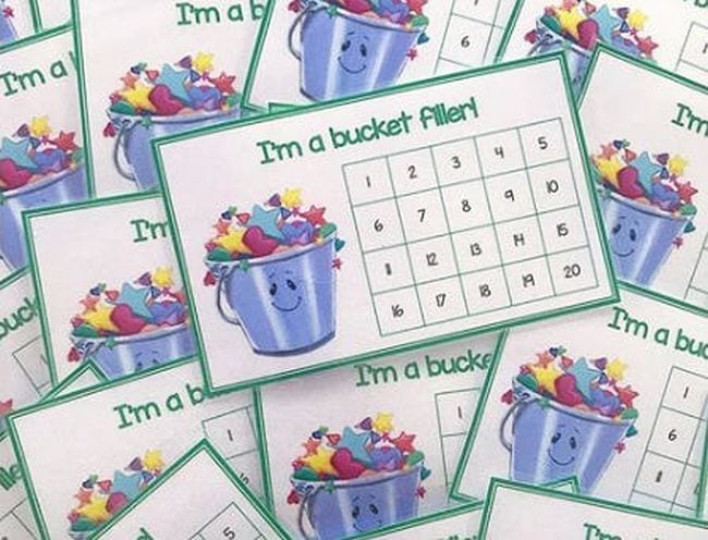 Paper cards with a picture of a bucket and squares numbered 1 through 20; text reads I'm a bucket filler! (Bucket Filler Activities)