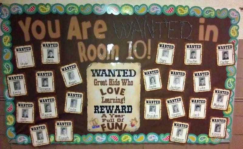 You Are Wanted in Room 101 bulletin board, with pictures of students on wanted posters (Back-to-School Bulletin Boards)
