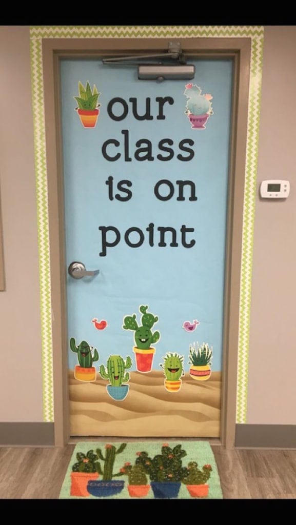 Classroom door decorated with cactuses and the words "our class is on point"