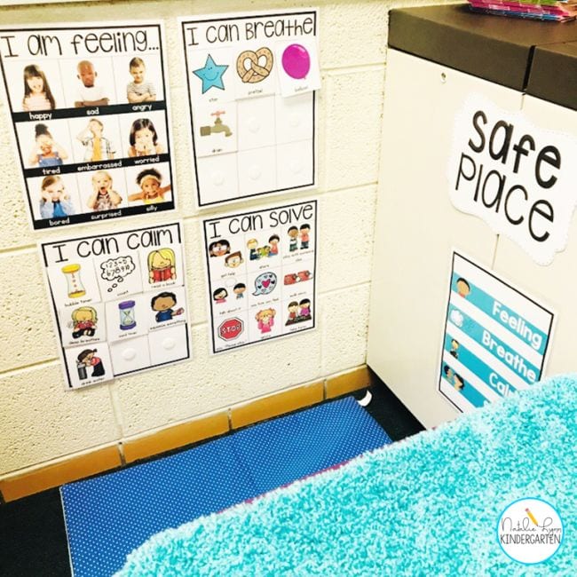 a classroom calm down corner with strategy posters posted on the wall