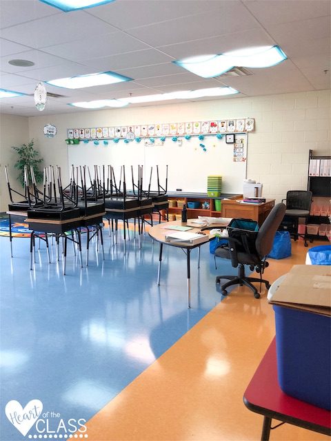 Classroom before photo with stacked desks