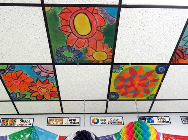Ceiling tiles decorated with colorful flowers in oranges and reds