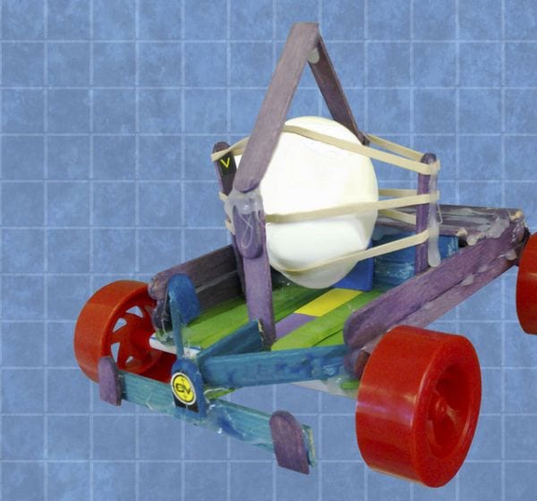 Toy car built from wood craft sticks, rubber bands, and other items, protecting an egg (NASCAR Teaching Ideas)