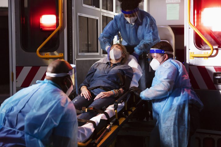 EMTs loading a patient on a gurney into an ambulance, , as an example of interactive career exploration activities