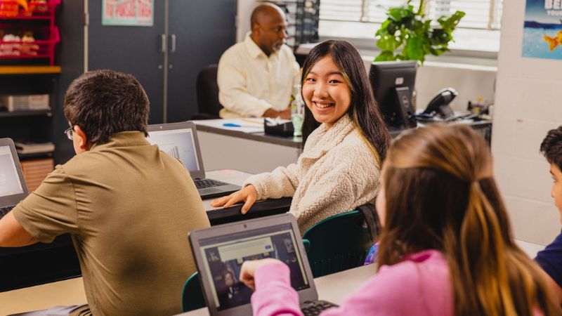 Middle school students working on financial literacy curriculum