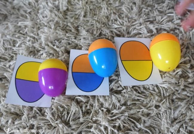 Plastic eggs put together to make colorful patterns that match cards