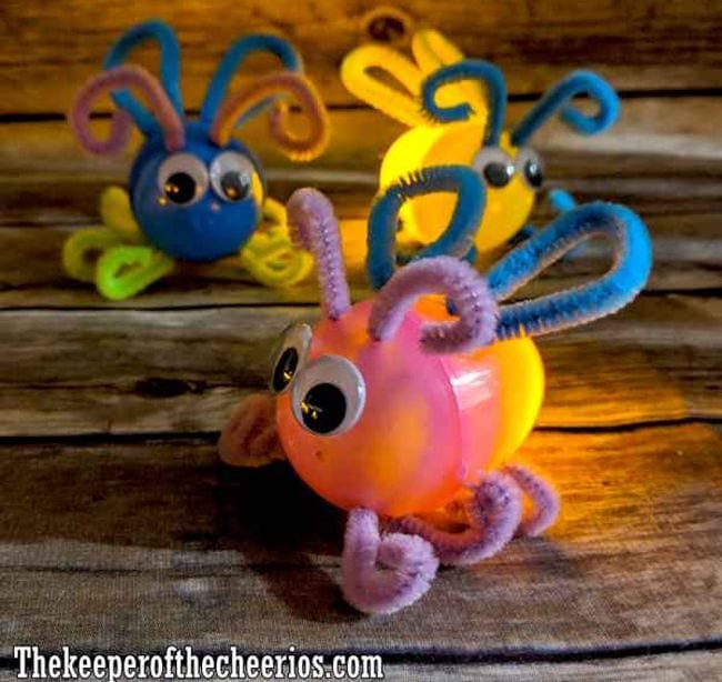Plastic Eggs turned into lightning bugs with pipe cleaners and wiggly eyes
