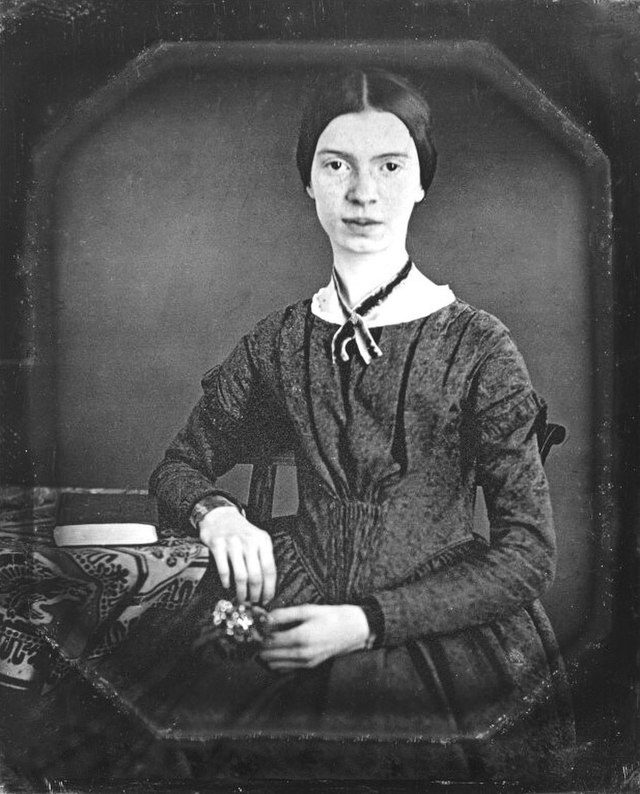 Black and white photograph of Emily Dickenson seated, as an example of famous poets kids should know