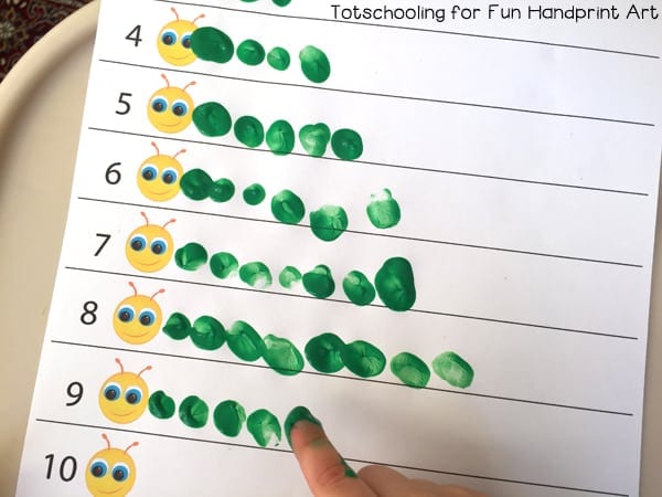 A worksheet showing caterpillars made from fingertips dipped in paint