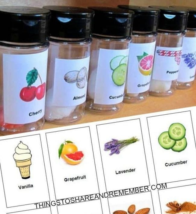 Small glass spice bottles labeled with pictures of various scents