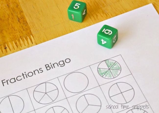 Bingo card made of circles broken into different fraction sections and a pair of green dice (Fraction Games)