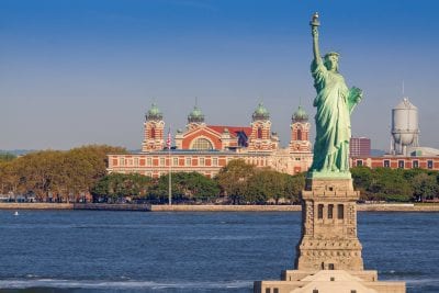 Statue of Liberty and buildings in the background.