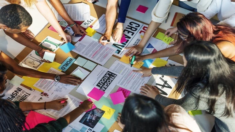 photo of students working together