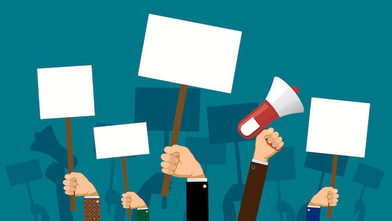 People hold banners and posters in their hands
