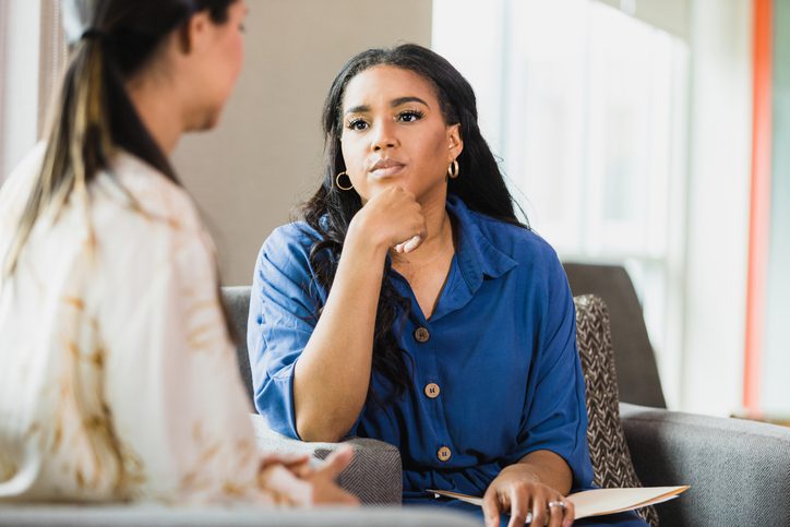 An empathetic counselor listens to a patient