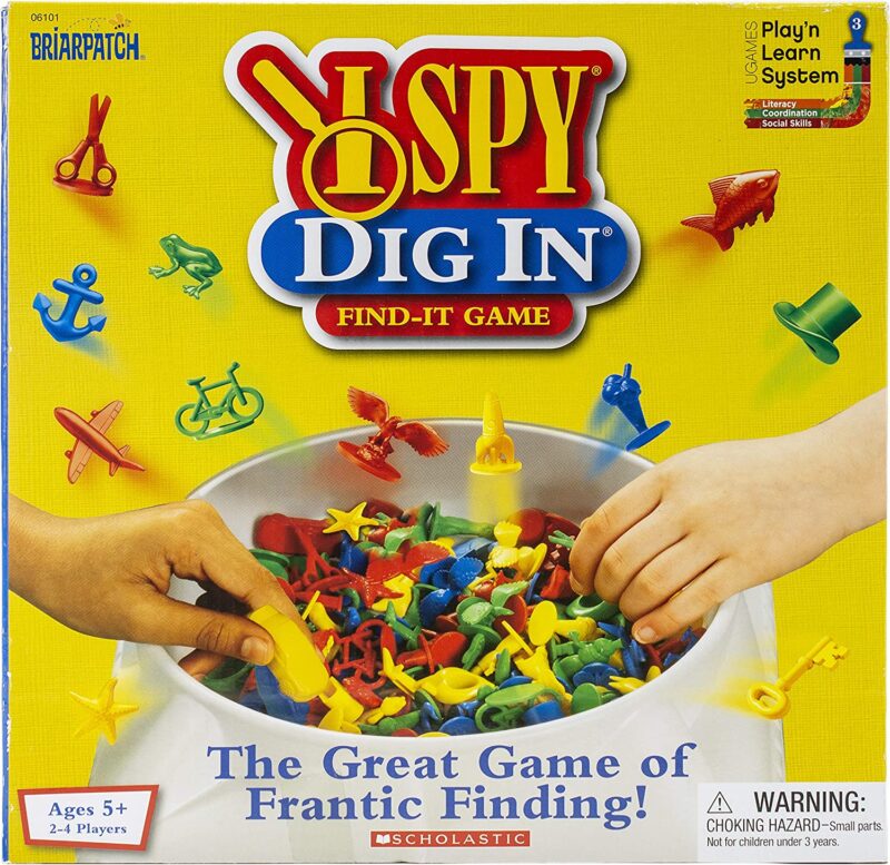 A box shows hands digging into a pile of small plastic toys. The text reads I Spy Dig In (best board games for preschoolers)