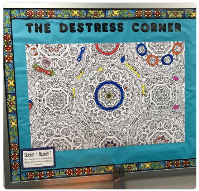 Bulletin board with a coloring poster. Text reads The Destress Corner.