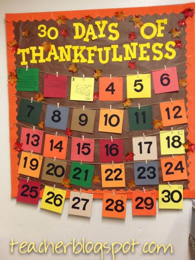30 Days of Thankfulness bulletin board with numbers 1 to 30. Several numbers are flipped and have reasons to be thankful written on the back. (Interactive Bulletin Boards)