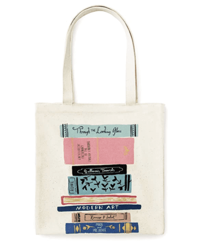 Kate Spade tan tote bag with books on it