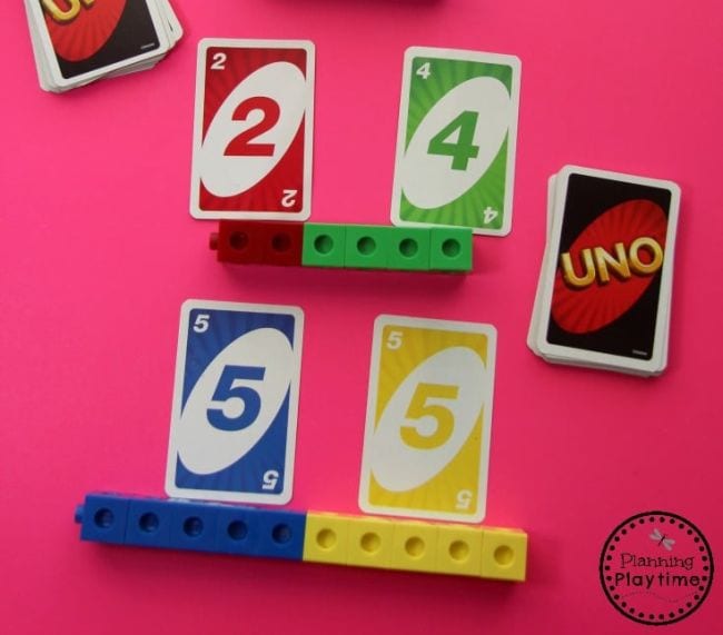 UNO cards with math cubes representing the numbers shown (Kindergarten Math Games)