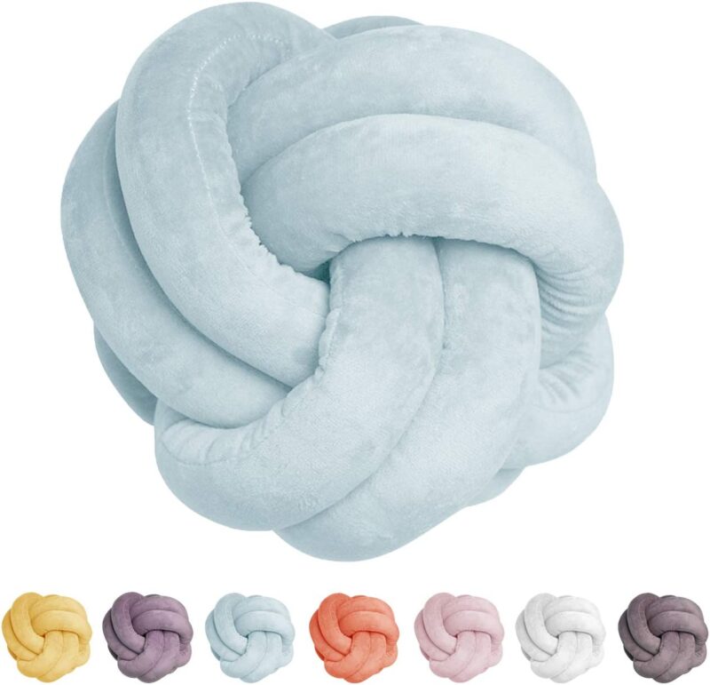 A blue pillow is twisted into a knot shape (sensory toys)