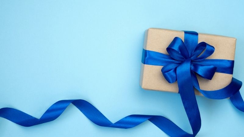 Package wrapped with blue bow