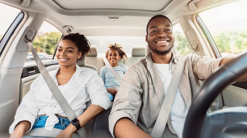Michigan Educator Insurance Black family driving in car
