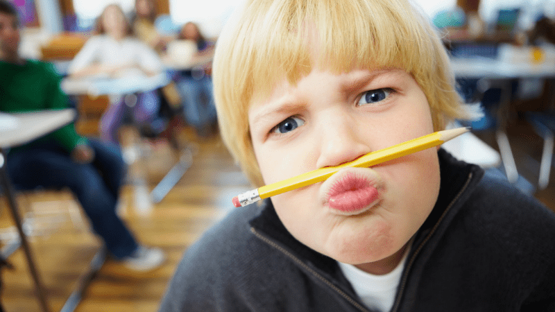 Mischievous school boy balancing a pencil on the nose - funny short story to share with your class