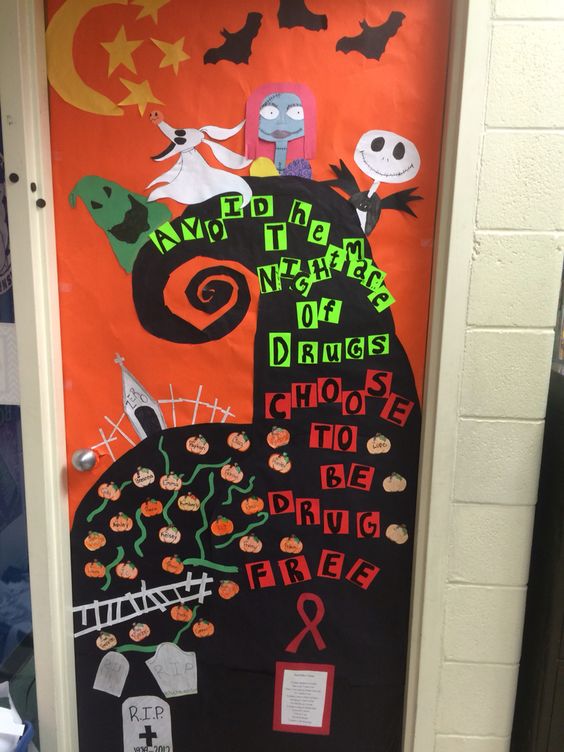 A classroom door is decorated to resemble a scene from The Nightmare Before Christmas including text that reads 