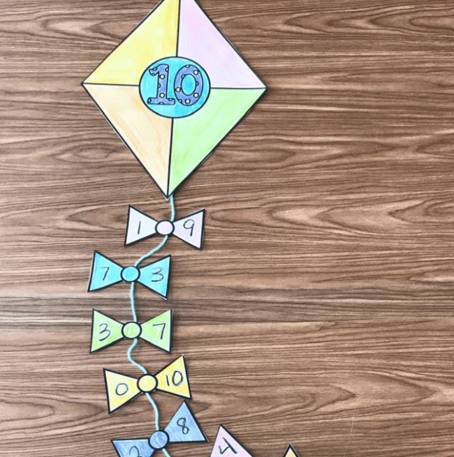 Paper kite with the number 10 on it, and the kite string tails showing ways to make 10
