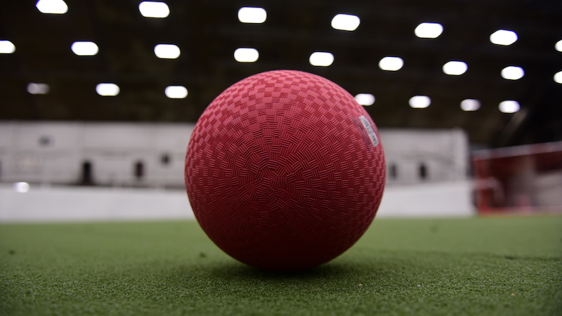 Cherry ball on an indoor field.