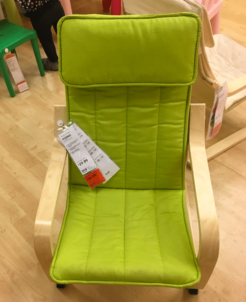 Comfy kid's wooden arm chair with green cushion