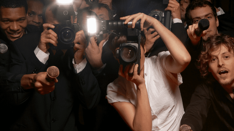 _Paparazzi photographers and television reporters at celebrity event - stock photo