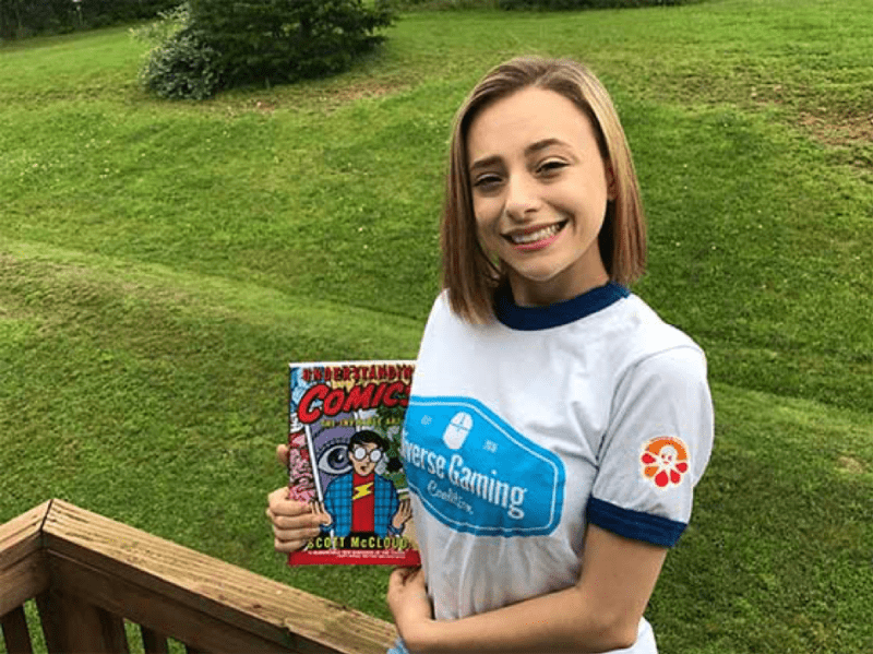 Girl with comic book -- Volunteer Projects Help Teens