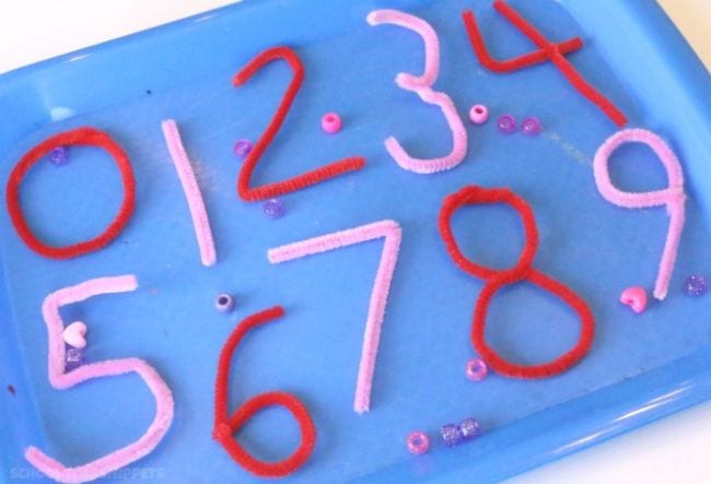 Red and pink numbers made from pipe cleaners