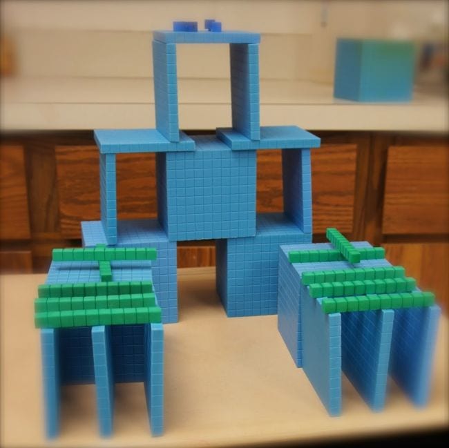 Base 10 blocks stacked into towers and other structures (Place Value Activities)