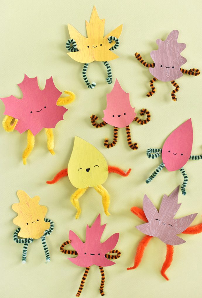 Playful leaves made from construction paper and pipe cleaners, as an example of DIY Thanksgiving crafts