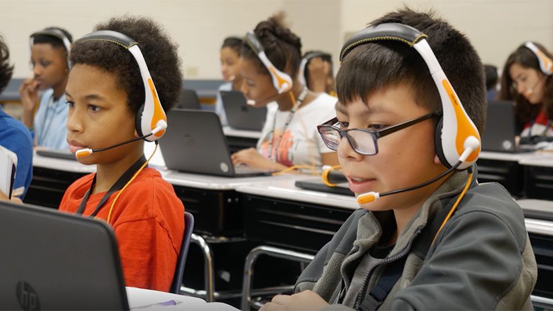 Students in headsets participating in virtual learning