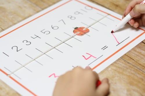 a numberline worksheet with a sliding pumpkin attached