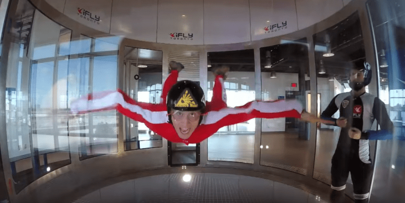 A woman in an anti-gravity machine, simulating flying.