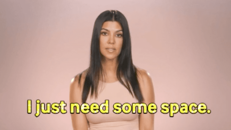 Kourtney Kardashian with a blank stare saying, "I just need some space."